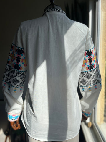 Ethnic Pattern Embroidered Blouse with Tassel Details – V-Neck Long Sleeve Bohemian Top